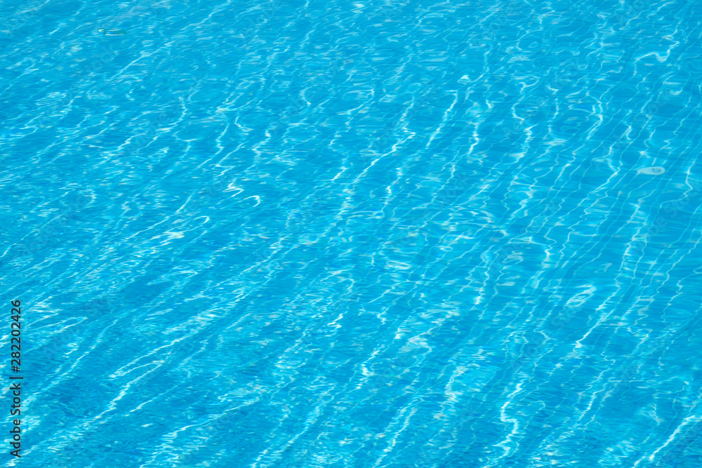Water in swimming pool. Blue background water in a pool