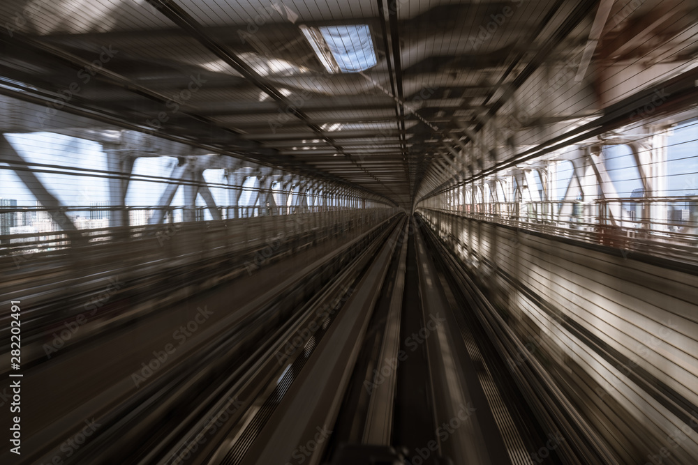 motion-blurred view from a moving train running in tunnel