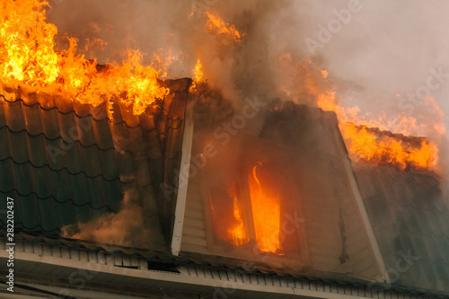 The roof of the house burns open flame