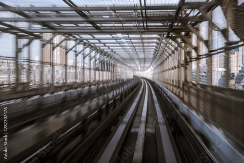 motion-blurred view from a moving train running in tunnel