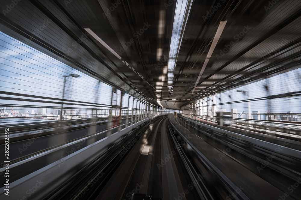 motion-blurred view from a moving train running in tunnel motion-blurred view from a moving train running in tunnel