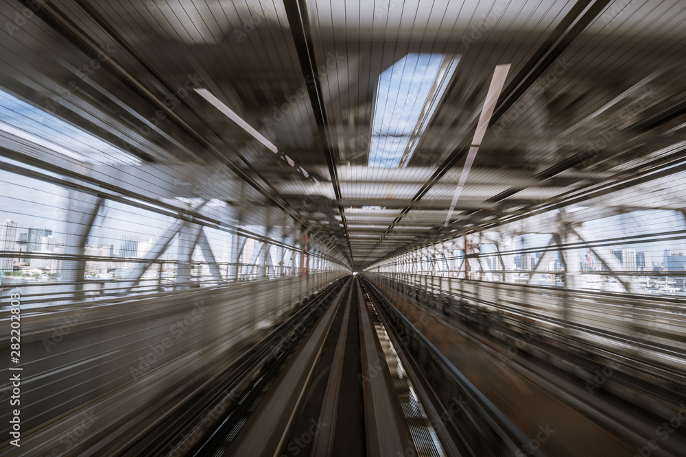motion-blurred view from a moving train running in tunnel motion-blurred view from a moving train running in tunnel