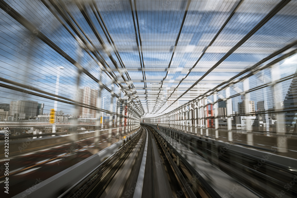 motion-blurred view from a moving train running in tunnel motion-blurred view from a moving train running in tunnel