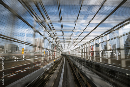 motion-blurred view from a moving train running in tunnel