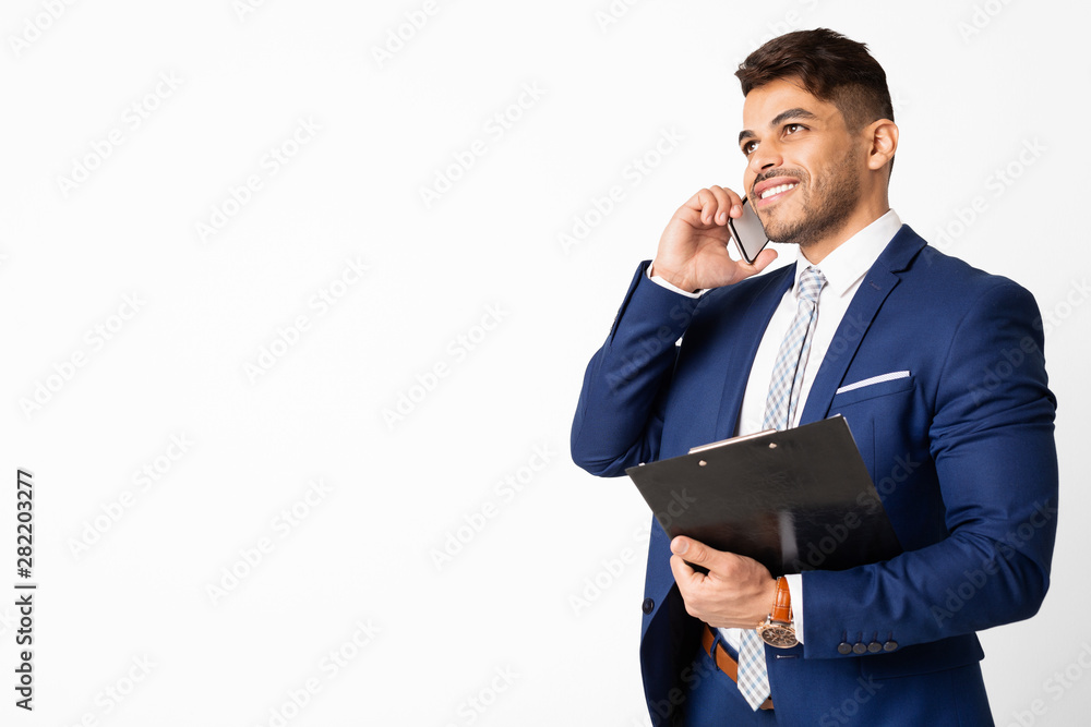 Arab Business Guy Talking On Cellphone And Holding Folder, Isolated Arab Business Guy Talking On Cellphone And Holding Folder, Isolated