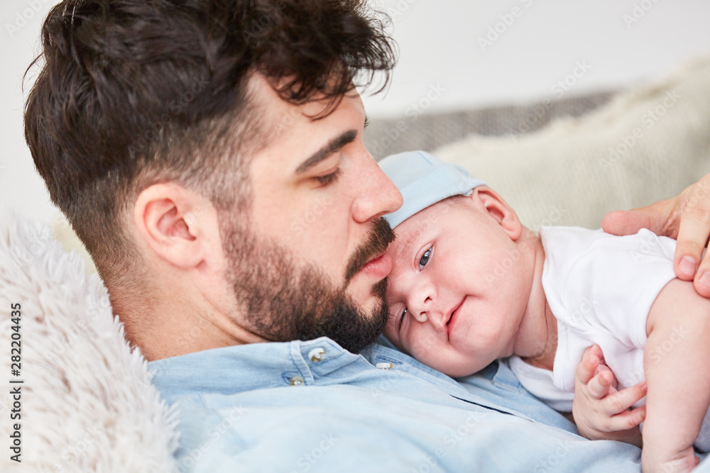 Father holds newborn baby in the arms Stock Photo | Adobe Stock