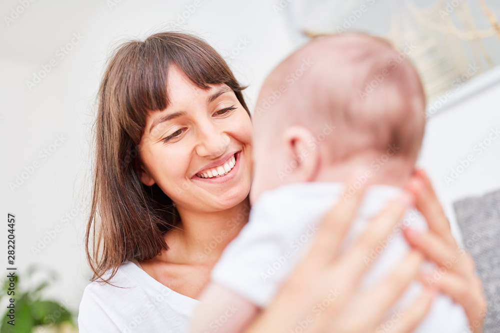 Young woman as a happy mother Young woman as a happy mother