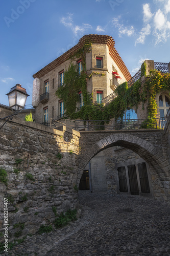 A spring scene of a beautiful alley in the fortified city of carcassone with beautiful buildings in France