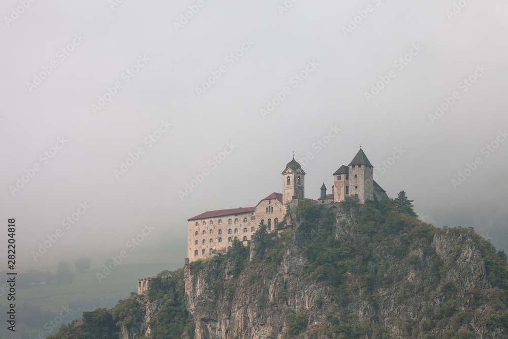 The monastery of Sabiona stands on a high cliff over the village of Chiusa in the Val d'Isarco