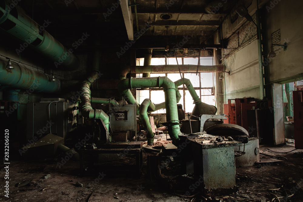 Dark industrial interior with machinery inside