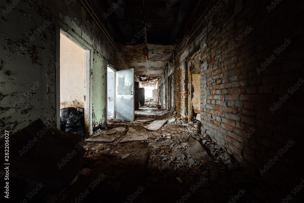 Abandoned corridor in damaged building Abandoned corridor in damaged building