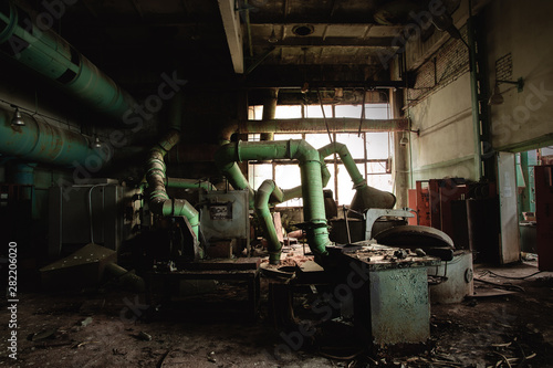 Dark industrial interior with machinery inside