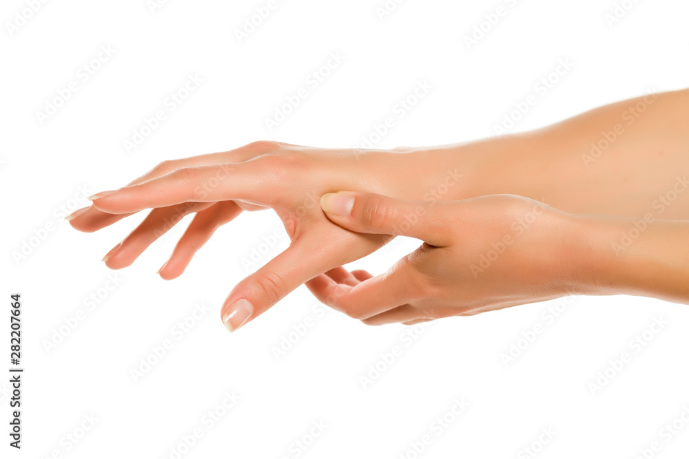 Young woman showing her hand, fingers and massage point. Closeup isolated on white background.