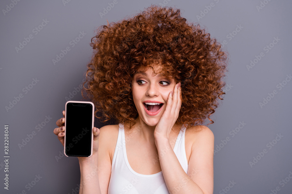 Close up photo of foxy lady hold hand new telephone model shock best low price wear white tank-top isolated grey background Close up photo of foxy lady hold hand new telephone model shock best low price wear white tank-top isolated grey background