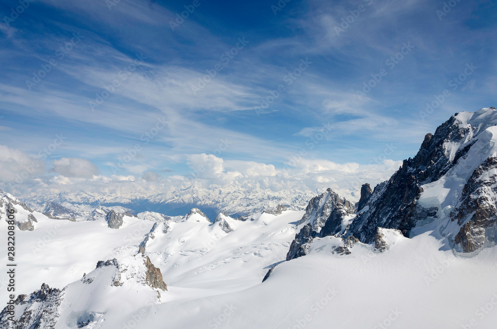 Obraz premium Air view. Beautiful dramatic cloudy sky , mountains and snow peaks. Mont Blanc. Chamonix. France