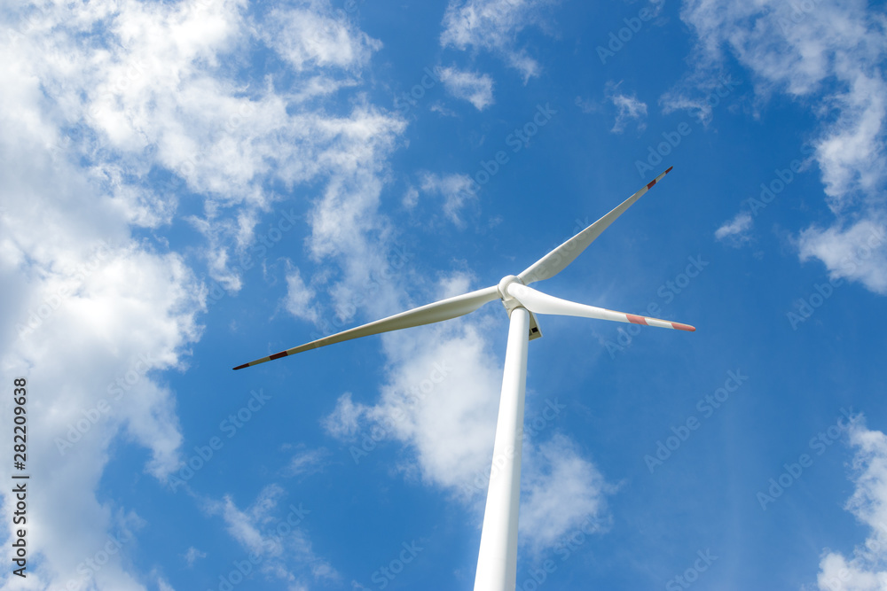 Wind turbine farm power generator in beautiful nature landscape for production of renewable green energy is friendly industry to environment. Wind turbine farm power generator in beautiful nature landscape for production of renewable green energy is friendly industry to environment.
