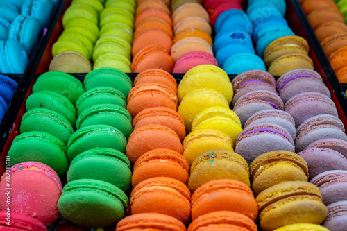 Pile of yummy and colorful macarons for sale at patisserie