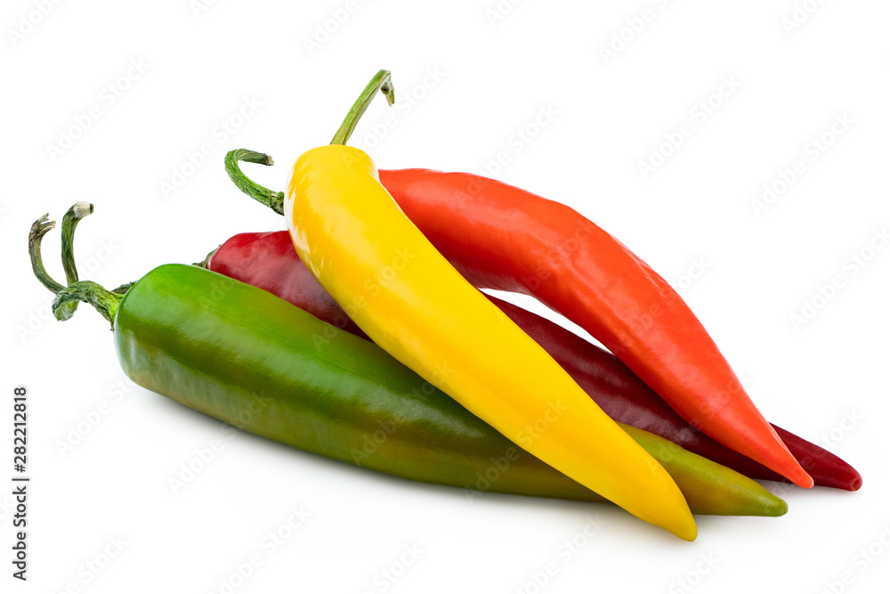 Pile of mixed red, yellow, orange and green cayenne chillies isolated on white.