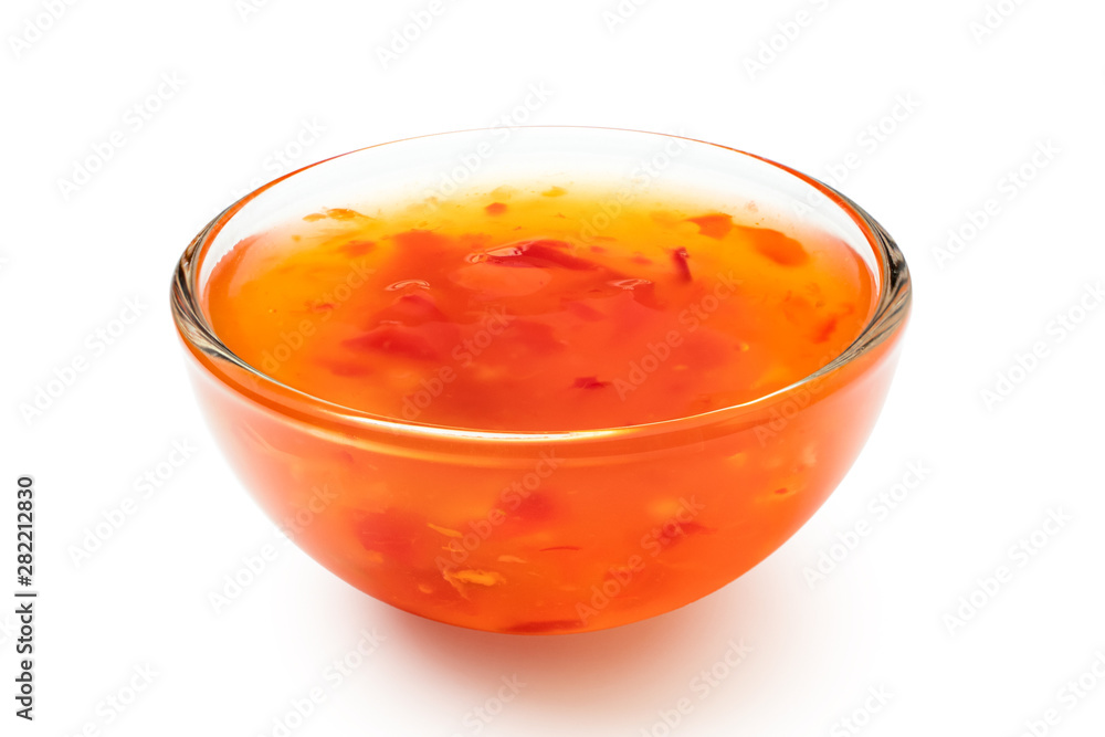 Sweet chilli sauce in a glass bowl isolated on white. Sweet chilli sauce in a glass bowl isolated on white.