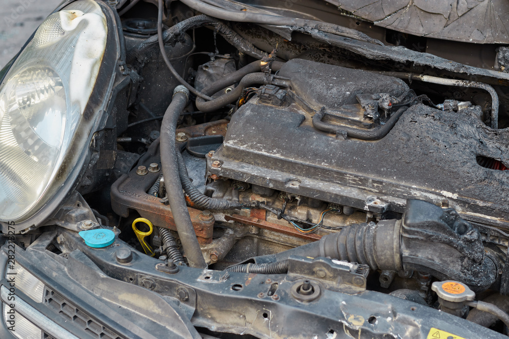 burnt car after a fire, body parts burnt door handles and cracked glass, the picture is not pleasant, insured car after a fire burnt car after a fire, body parts burnt door handles and cracked glass, the picture is not pleasant, insured car after a fire