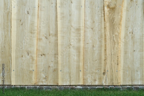 Fence of natural poplar boards