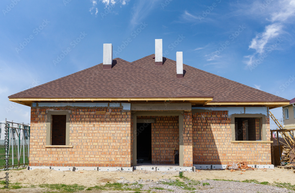 New and modern brick house under construction New and modern brick house under construction