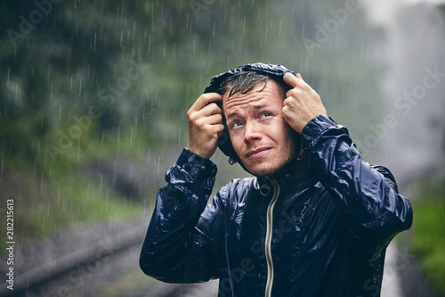 Traveler in heavy rain