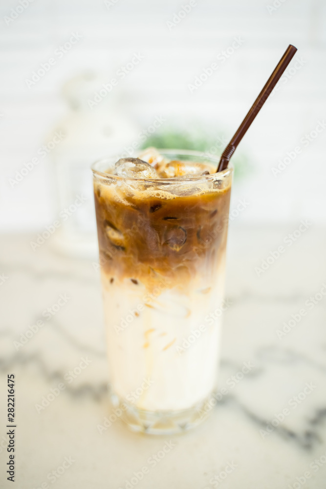 Closeup a glass of iced espresso machiano Closeup a glass of iced espresso machiano