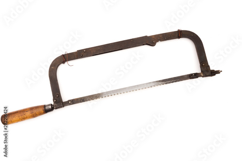Old rusty hacksaw, isolated on white background.
