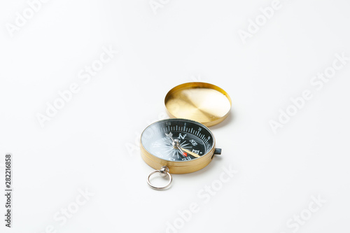 Golden vintage compass isolated on white background