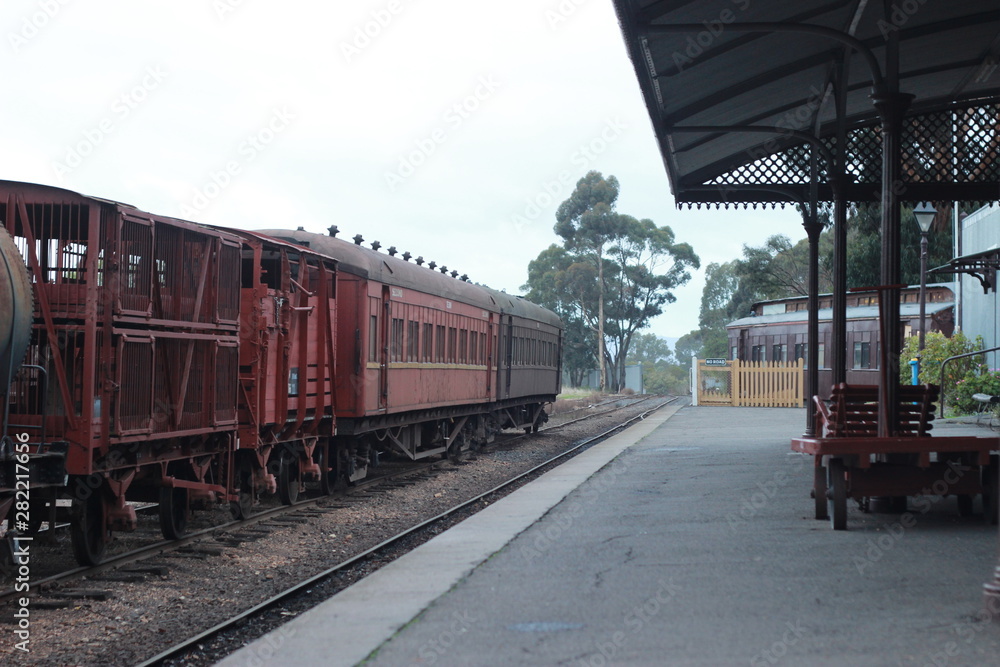 vintage old steam railway carts and carriages parked at an old operational steam engine museum station in rural Victoria, Australia