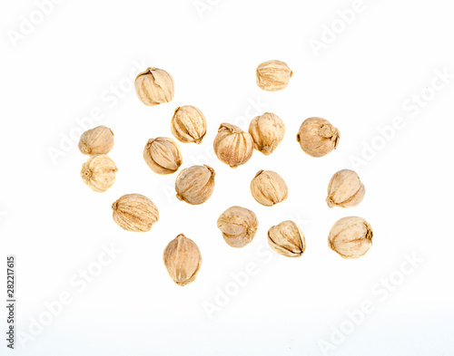 dry cardamom on a white background (top view)