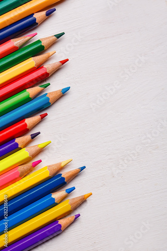 Bright color palette of crayons on the table