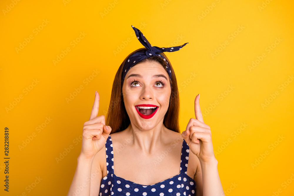 Close-up portrait of nice attractive glad amazed cheerful cheery positive straight-haired girl pointing two forefingers up advert decision isolated over bright vivid shine yellow background Close-up portrait of nice attractive glad amazed cheerful cheery positive straight-haired girl pointing two forefingers up advert decision isolated over bright vivid shine yellow background