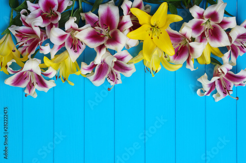 lily flowers on wooden planks