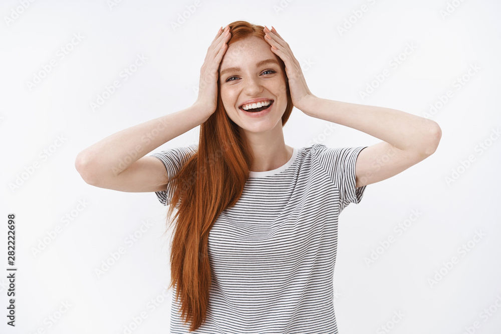 Carefree delighted amused happy charming ginger girl blue eyes grab head hands surprised reacting awesome good news perfect b-day surprise thankfully grinning laughing cheerfully, white background Carefree delighted amused happy charming ginger girl blue eyes grab head hands surprised reacting awesome good news perfect b-day surprise thankfully grinning laughing cheerfully, white background