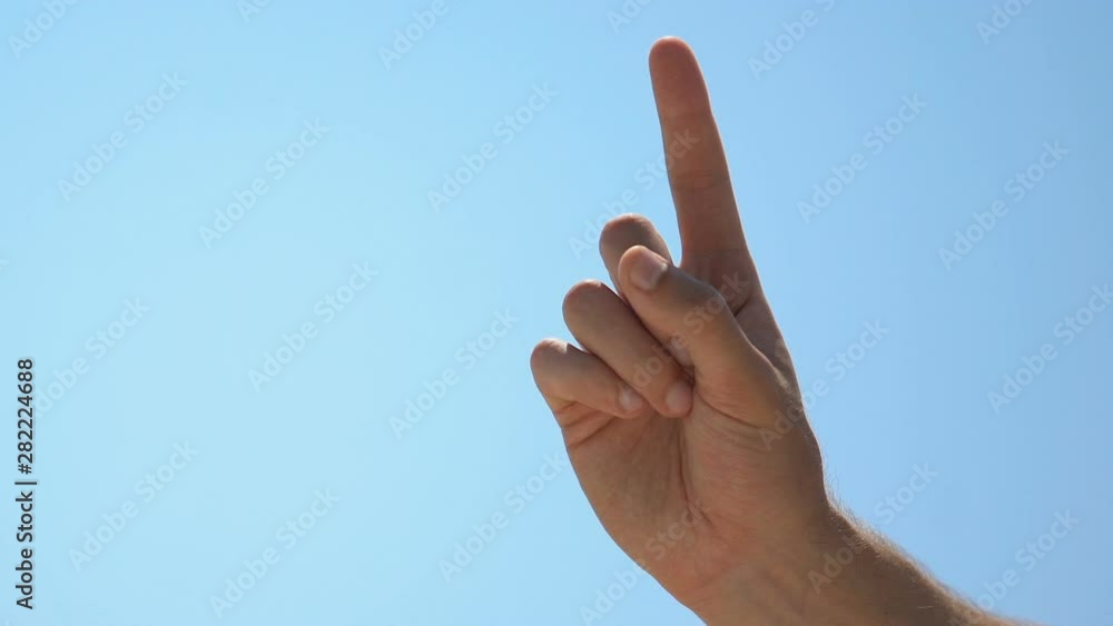 Male pointing finger up, attention to important idea or warning, wise choice Male pointing finger up, attention to important idea or warning, wise choice