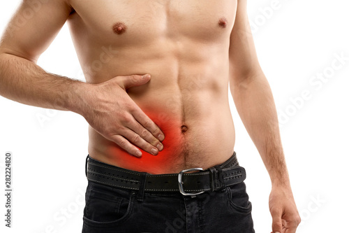 Crop man having appendicitis pain