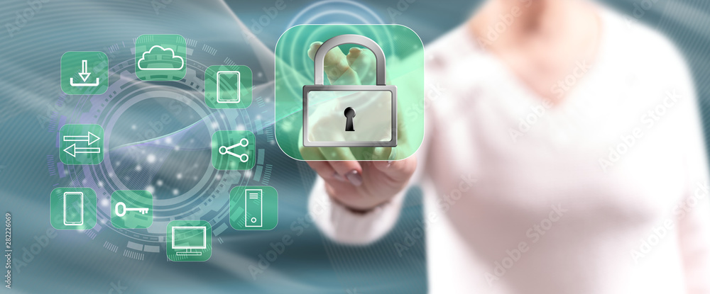 Woman touching a digital security concept Woman touching a digital security concept