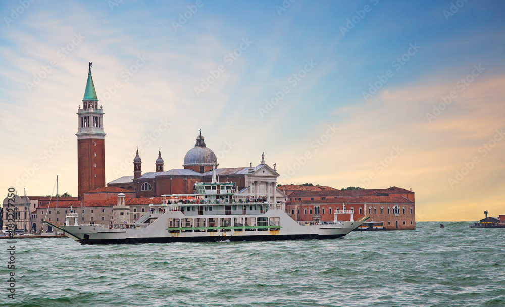 Venice, Italy, San Giorgio Maggiore Island.  The main attraction of the island is the Cathedral of San Giorgio Maggiore. A great combination of brick-red color of the Basilica and the color of white s