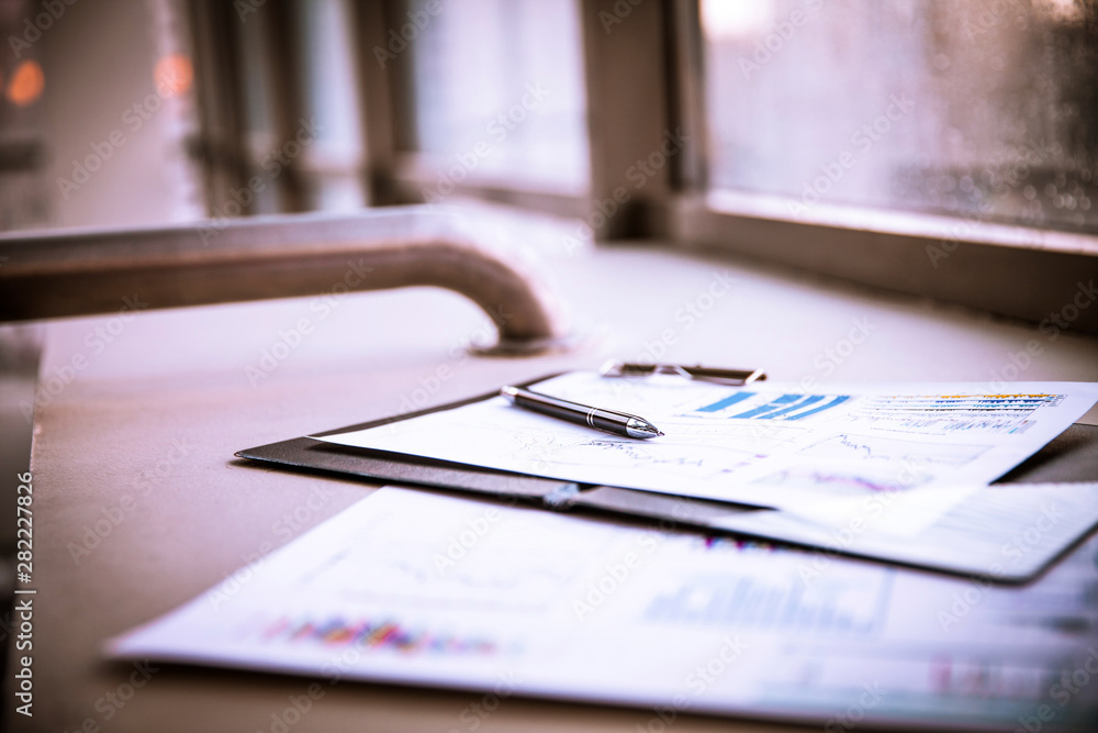 business documents with charts growth, keyboard and pen. business documents with charts growth, keyboard and pen.