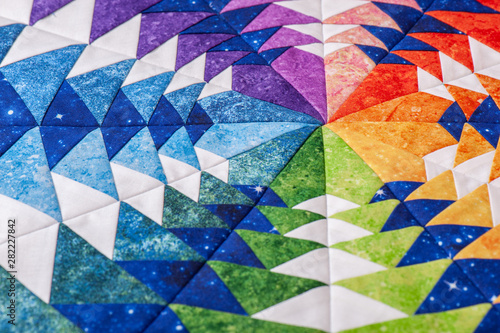 Foto Fragment of hexagon patchwork block like kaleidoscope, detail of quilt, colors o