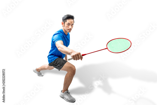 Asian man playing badminton