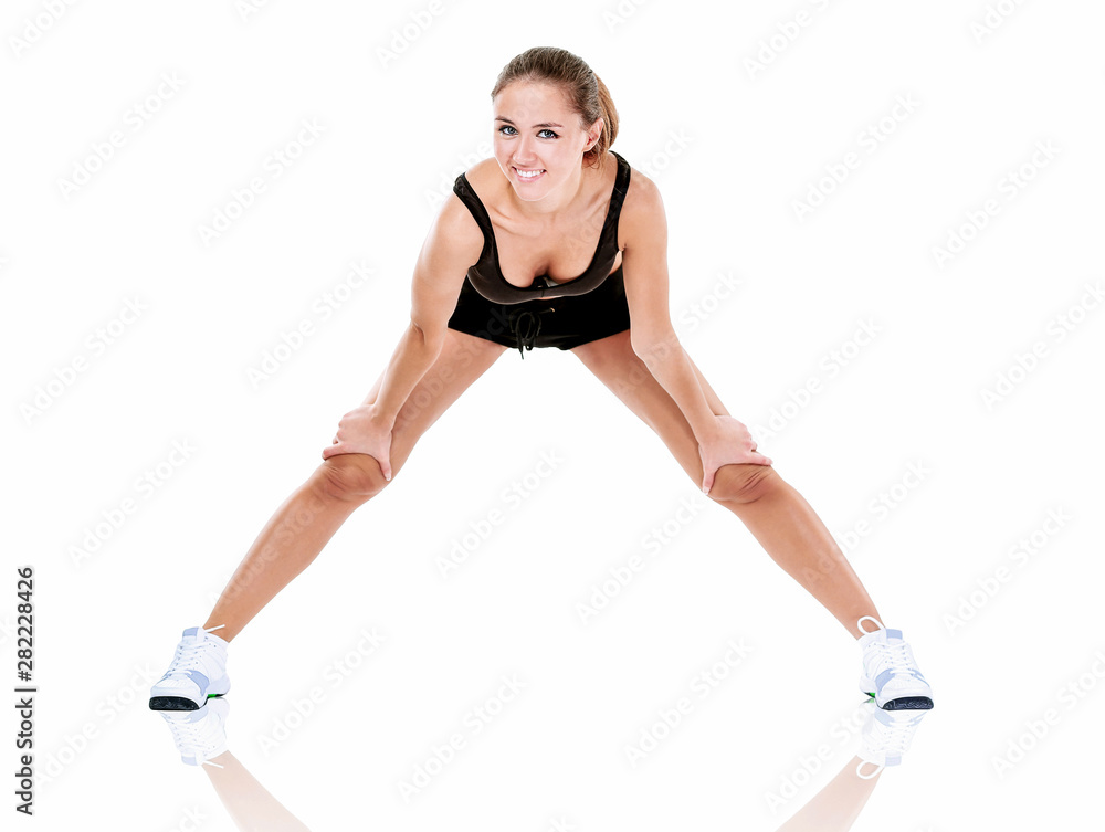 pretty brunette in black active wear, white background pretty brunette in black active wear, white background