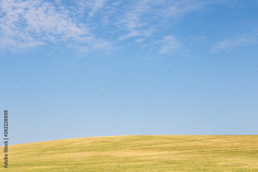 Fototapeta premium Minimalist view of landscape with meadow and sky
