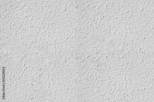 Rough plaster background with grainy effect surface