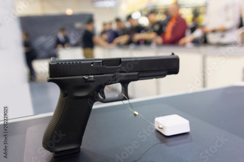 Gun on a shop window close-up. Weapons photo