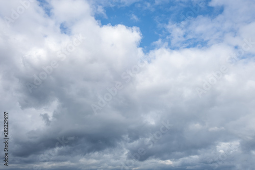 light fluffy clouds on a bright blue sky