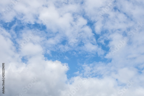 light fluffy clouds on a bright blue sky © Mariia