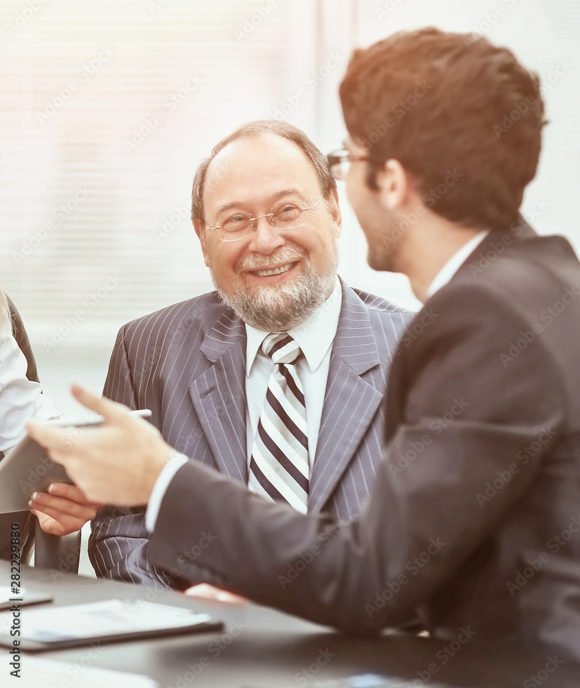 two business team works with the financial documents in the office two business team works with the financial documents in the office